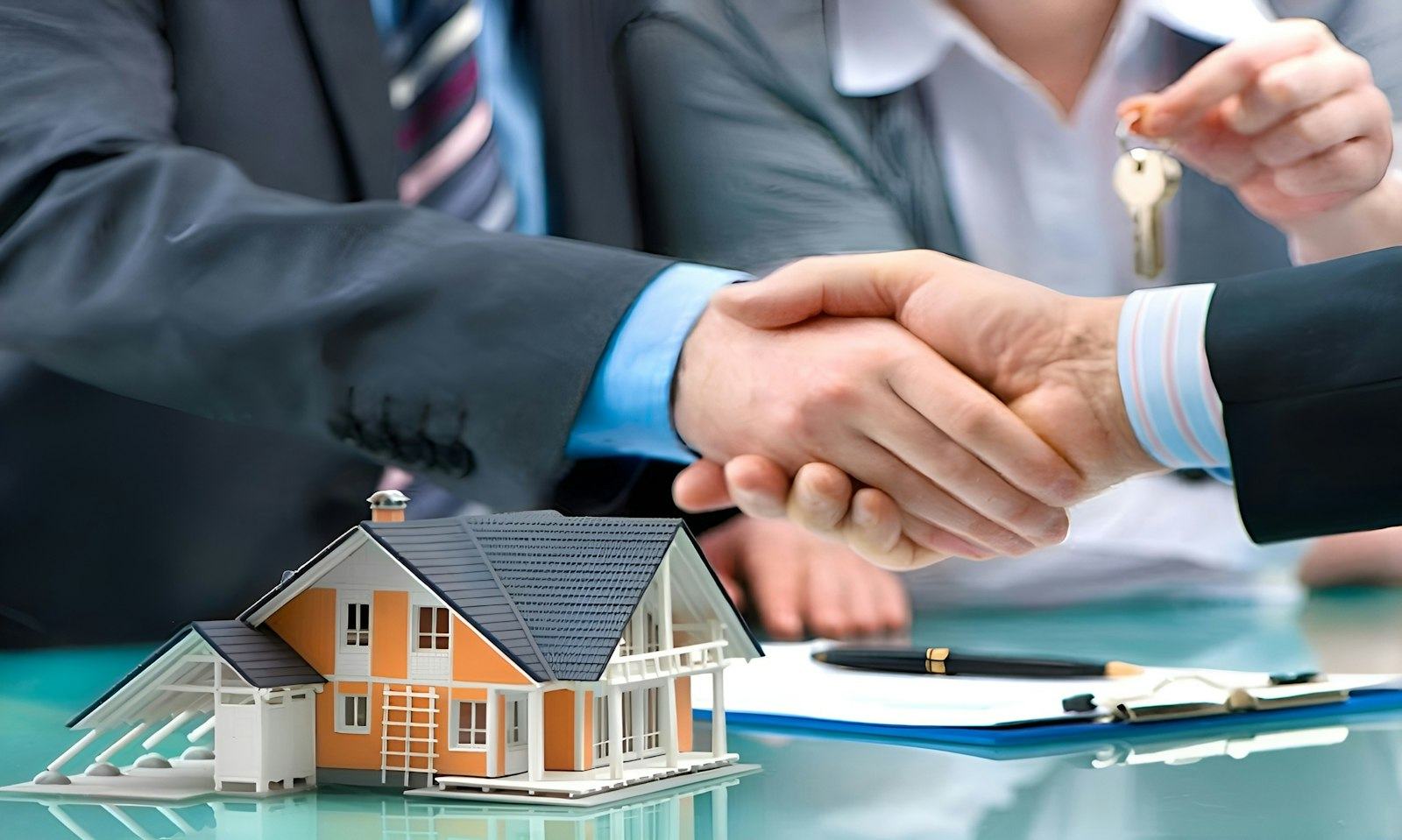 Handing over house keys after a sale